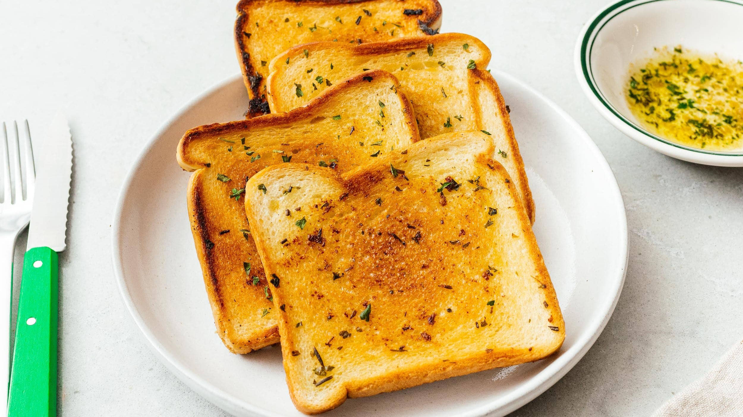 Texas toast is a toasted bread that is typically made from sliced bread that has been sliced at double the usual thickness of packaged bread. Texas to...